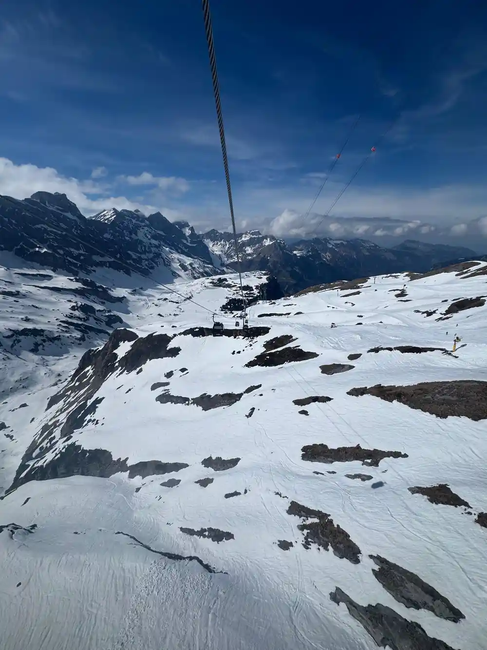 Bare snow slopes and rock below the top station