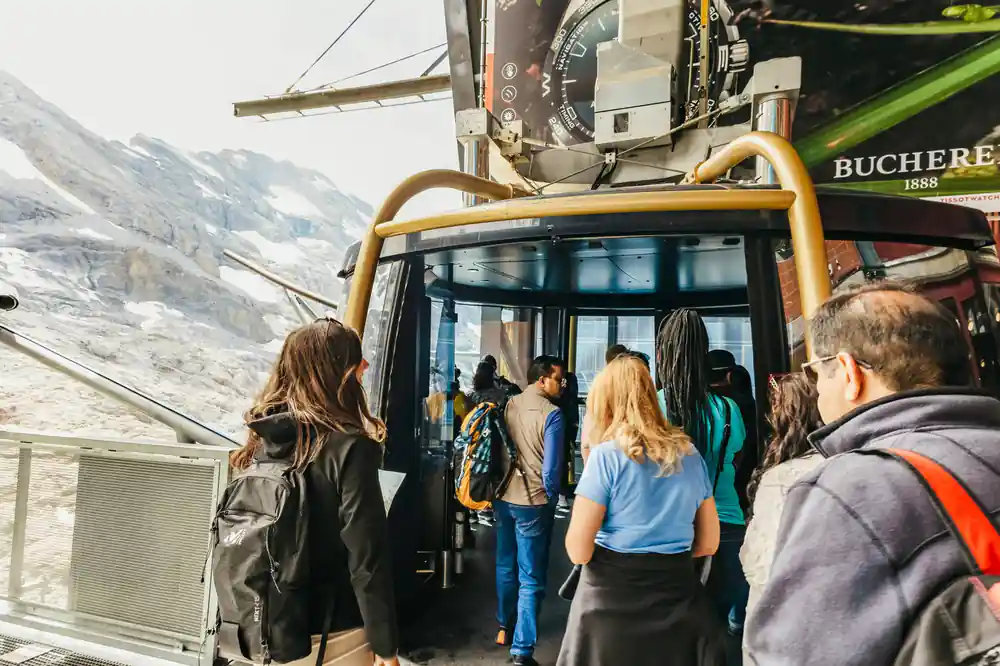 Passengers boarding the large revolving cable car cabin