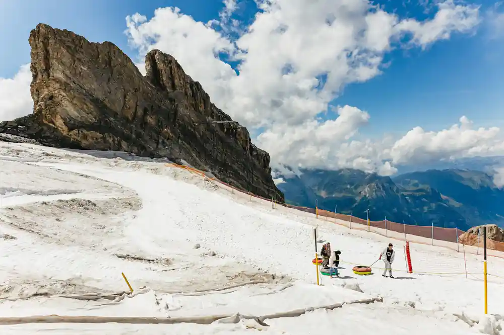 The snowfield at the top station with the tubing run beyond